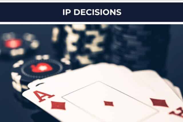 Poker cards and casino chips on a table, with the words “IP Decisions” displayed above.